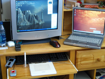 This photo of an at home computer station probably looks familiar to anyone who has computers at home.  Isn't that everybody yet?  Photo by an unknown photographer.